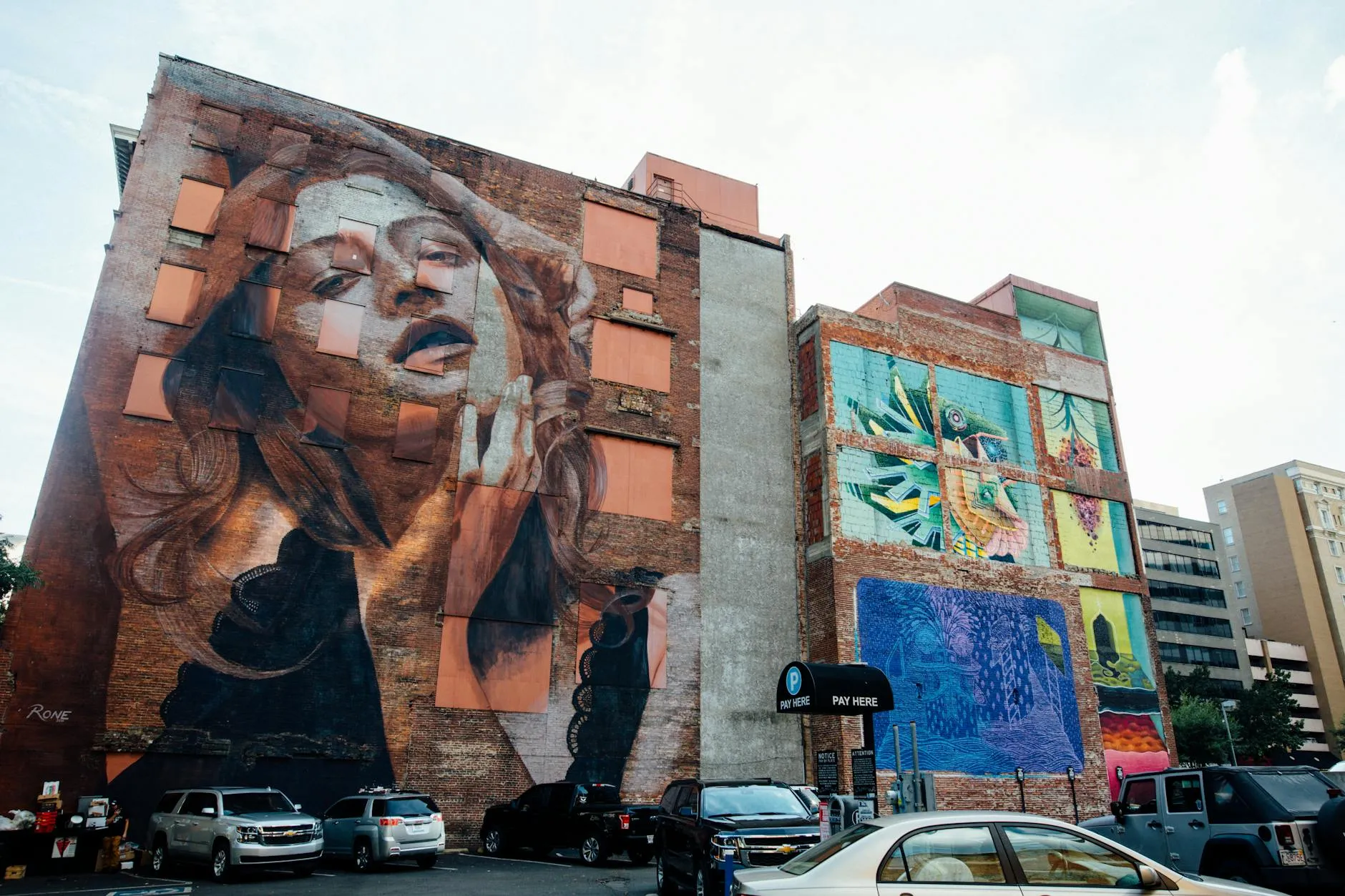 Dynamic street art murals on a city wall showcasing urban creativity