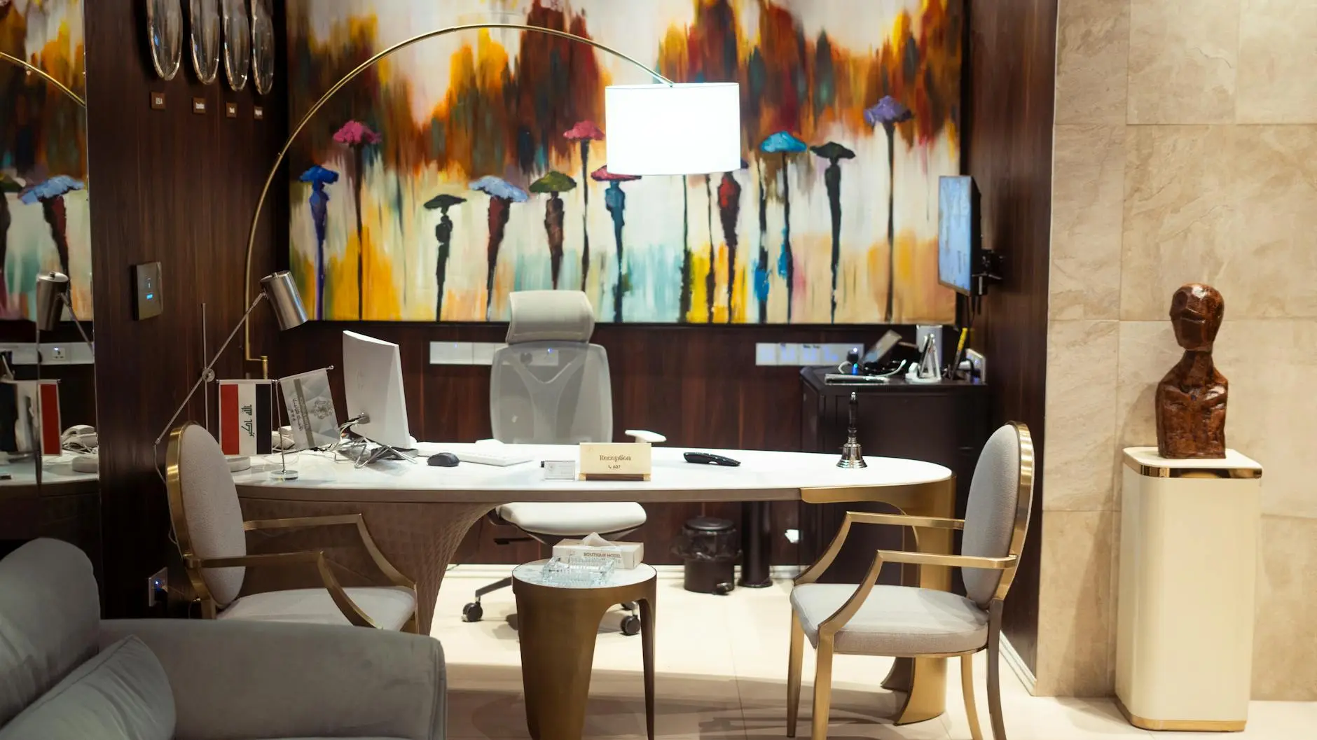 Modern office reception featuring vibrant wall art and contemporary furniture