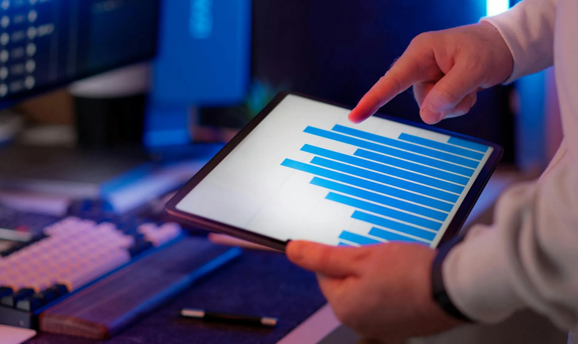 Professional analyzing data visualization on a tablet